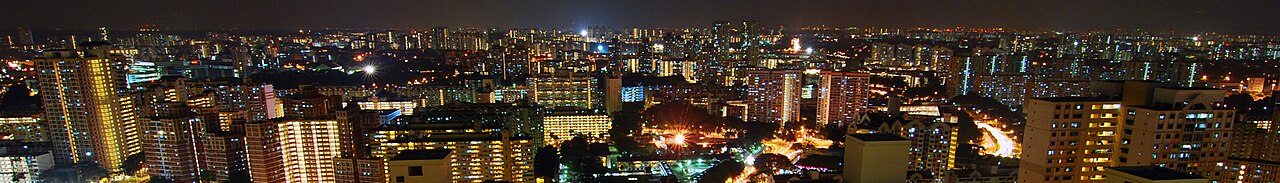 Singapore high-rise housing at night with illuminated windows