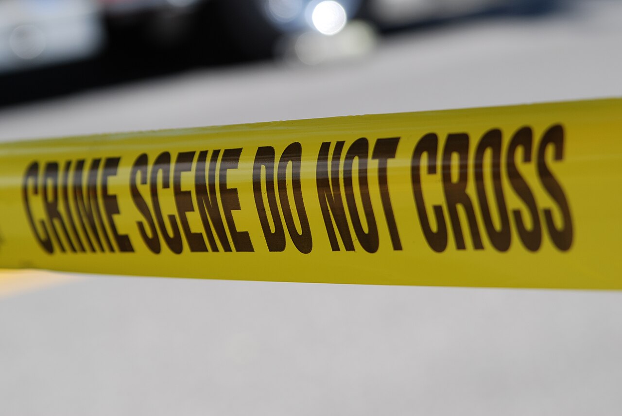 Crime scene tape marking an active investigation perimeter
