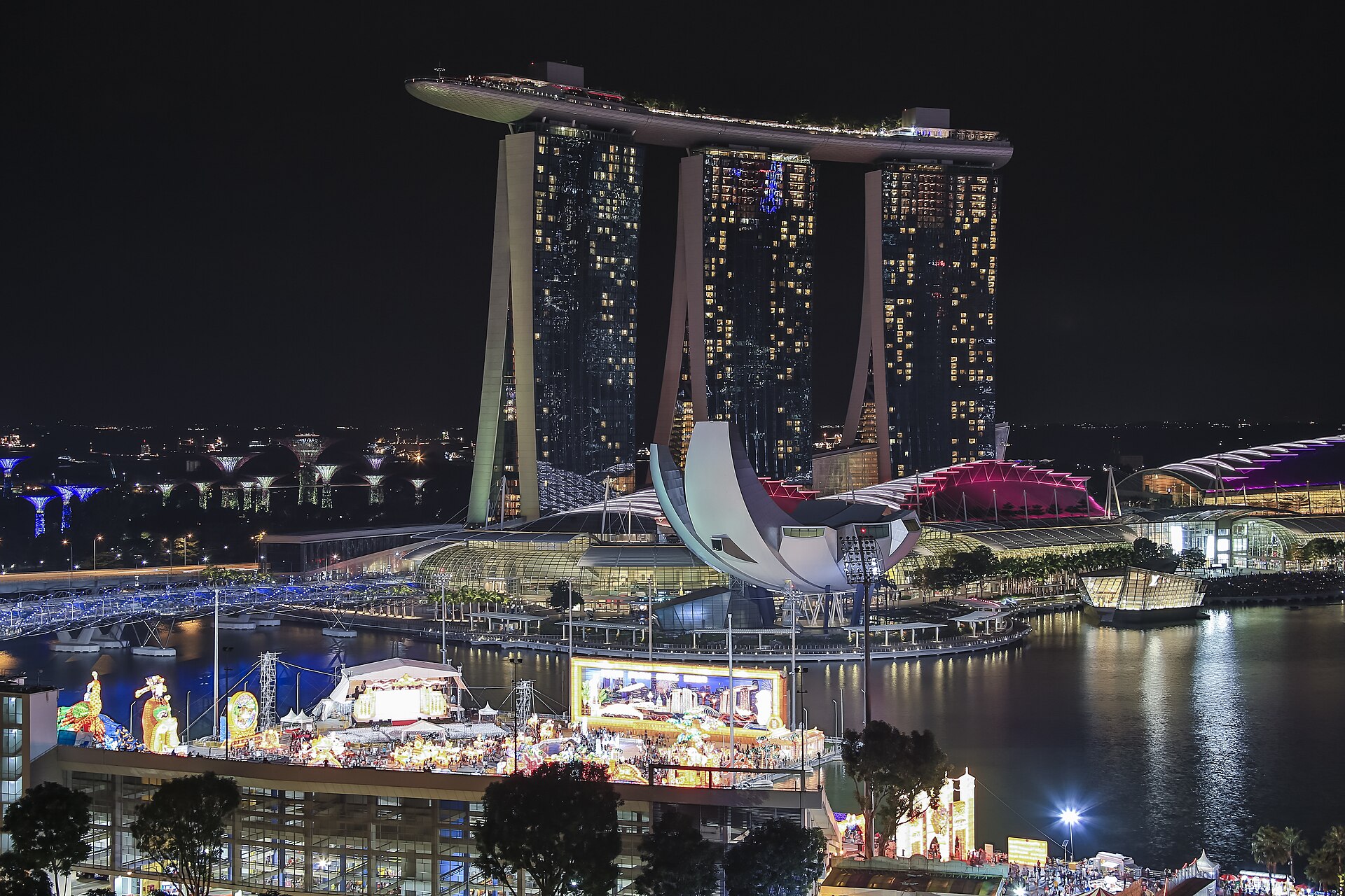 Marina Bay Singapore at night — the city-wide aftermath framing used in closing episodes